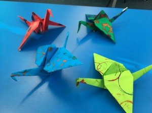 Art Week - image of four completed Origami birds in colourful paper made by Year 3