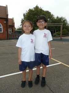 Image of two pupils wearing the school PE uniform
